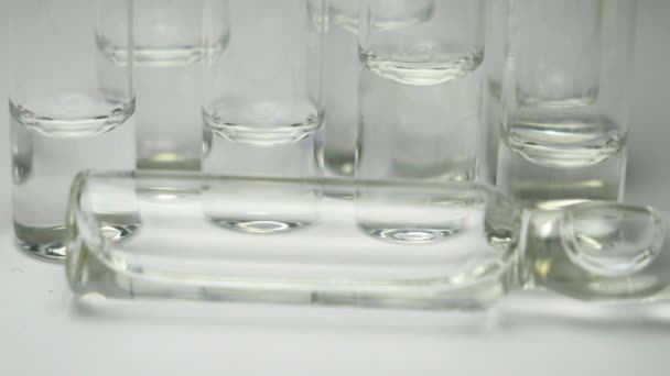 Ampoules with a clear solution for injection. panning close-up - Πλάνα, βίντεο