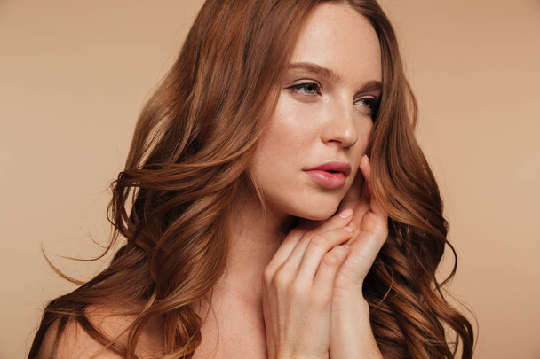 Close-up Beauty portrait of pretty ginger woman with long hair - Photo, image