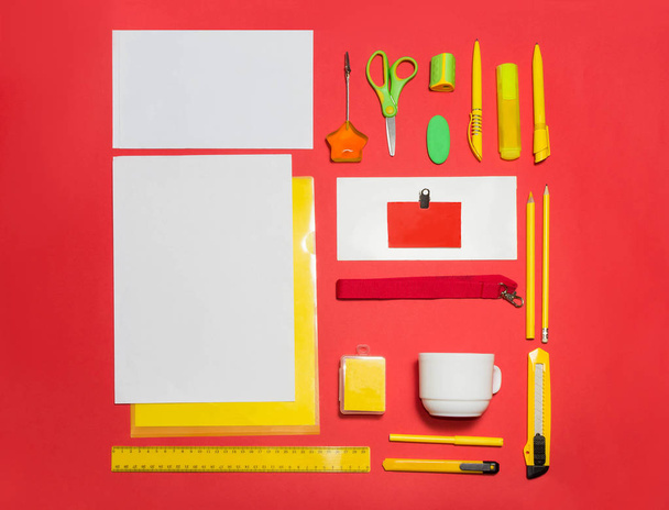Mock-up business template with cards, papers, pen. red background. - Photo, Image