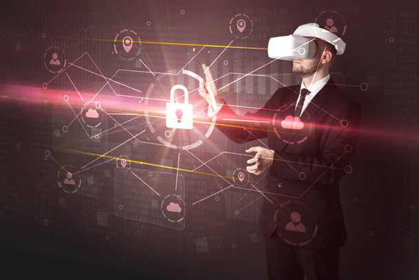 Man with VR goggles unlocking 3D network concept - Photo, image