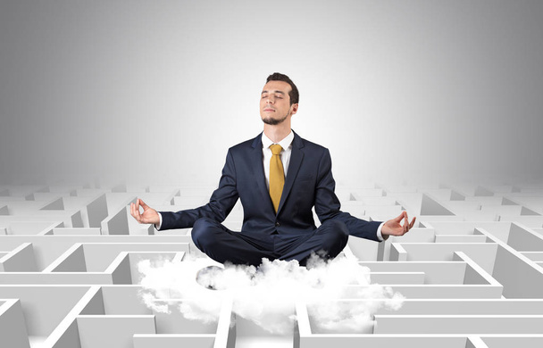 Businessman meditates on a cloud with maze concept - Fotografie, Obrázek
