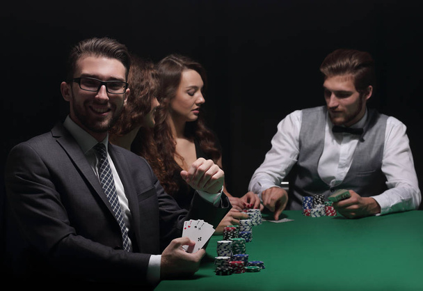 businessman showing four aces - Фото, изображение