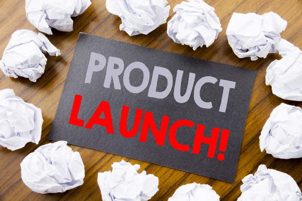 Hand writing text caption showing Product Launch. Business concept for New Products Start written on sticky note paper on the wooden background with folded paper meaning thinking - Photo, Image