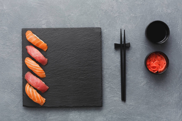Sushi set and chopsticks, top view - Foto, afbeelding
