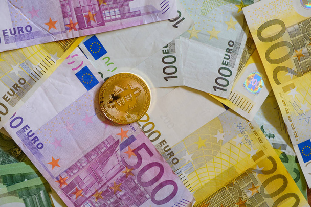 Gold Bitcoins, Crypto currency and Euro banknotes - Photo, Image