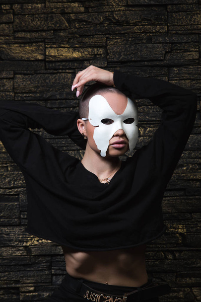 Shaved young model in mask - Фото, зображення
