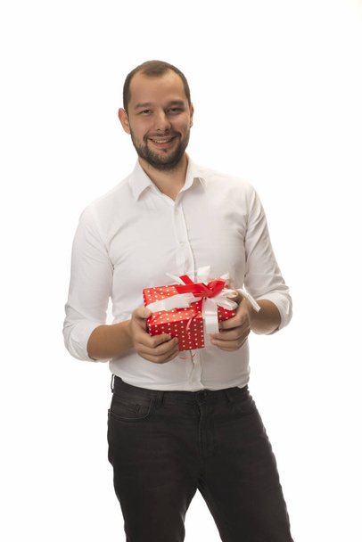Young handsome man with present box  isolated on white background - Φωτογραφία, εικόνα