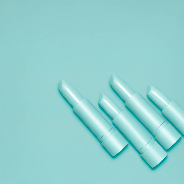Creative still life of mint open lipsticks for makeup on mint background. - Valokuva, kuva