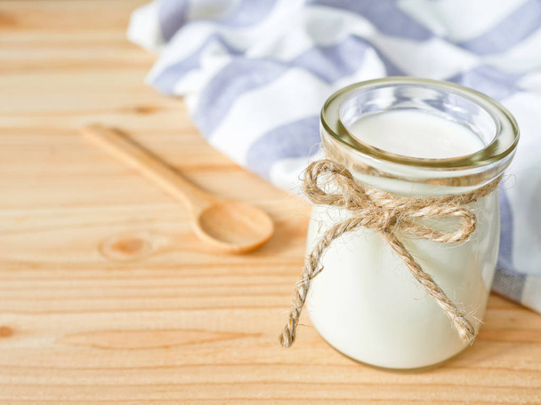 A jar of plain yogurt  - Фото, зображення
