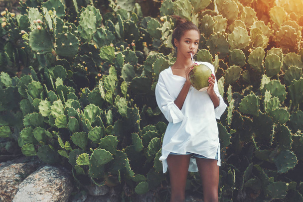 Foxy black girl with fresh coconut - Photo, Image