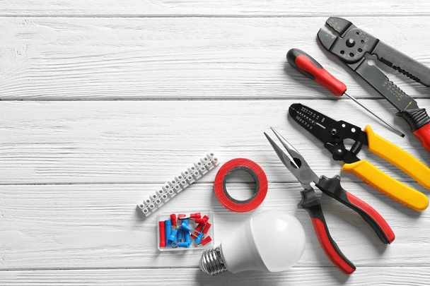 Different electrical tools on wooden background - Foto, immagini