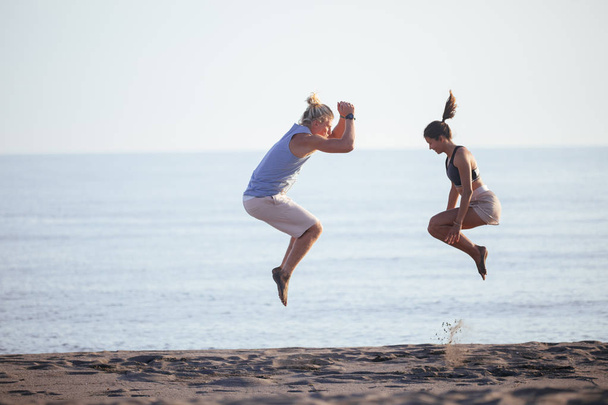 Couple Doing Exercises Together - 写真・画像