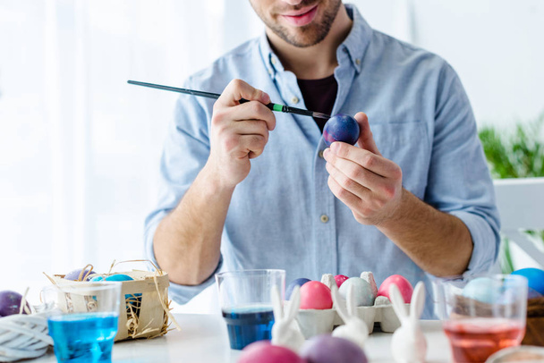 Close-up view of man painting Easter eggs - Photo, Image