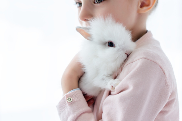 Adorable kid hugging white rabbit  - Photo, Image