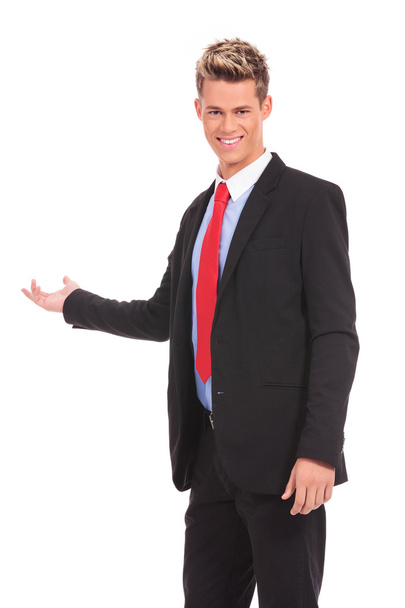 young business man presenting something - Foto, Imagen