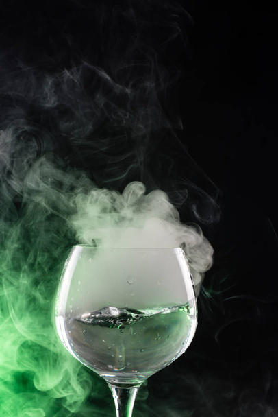 Wine glass with smoke inside and out - Zdjęcie, obraz