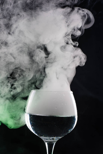 Wine glass with smoke inside and out - Photo, Image