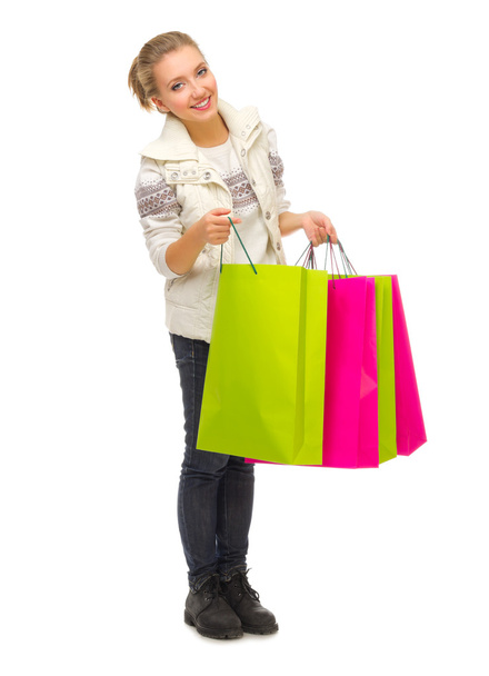 Young smiling girl with bags - Foto, imagen