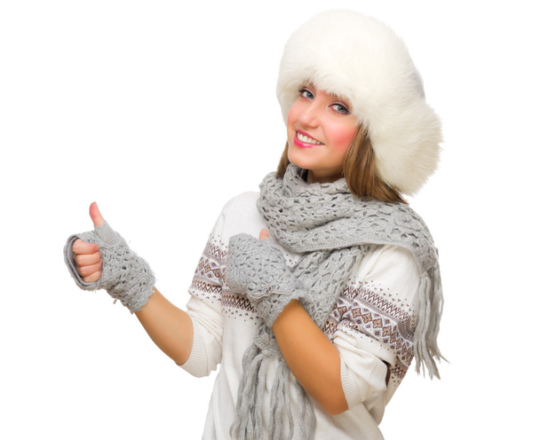 Young girl with fur hat showing ok gesture - Φωτογραφία, εικόνα