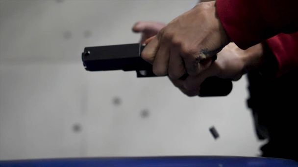 Trainer is teaching man to shoot a gun close up. Close up of male hands with a gun, man trains to shoot. Special police unit in training, school. Military shooting Short Gun - Photo, Image