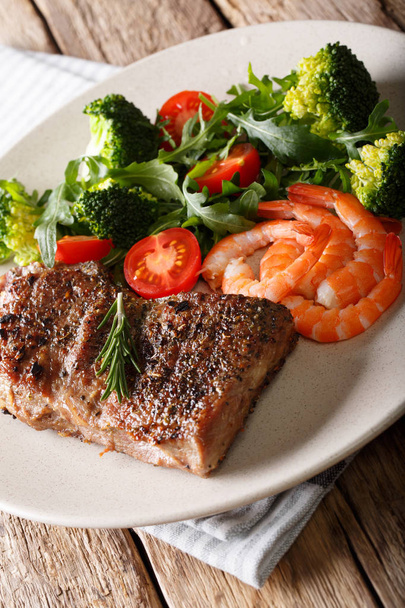 Delicious juicy barbequed steak and prawns with vegetable salad  - Photo, Image