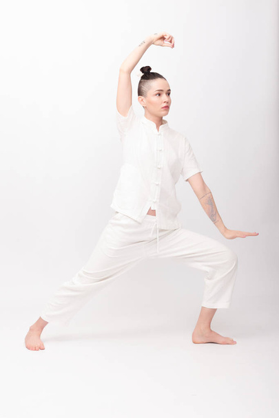 Young woman doing yoga exercise - Valokuva, kuva