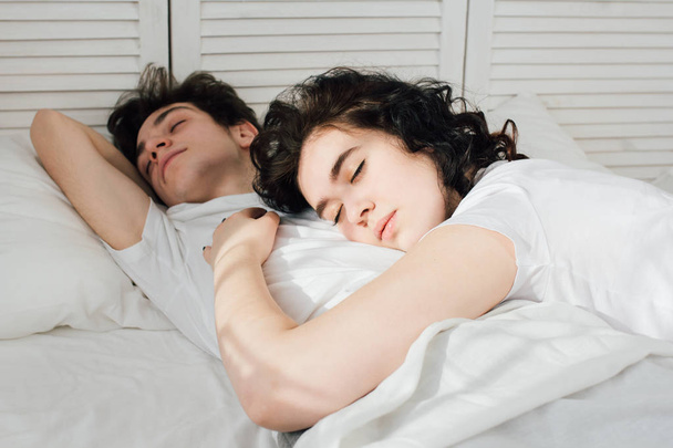 Couple in love sleeps cuddling in bed  - Fotó, kép