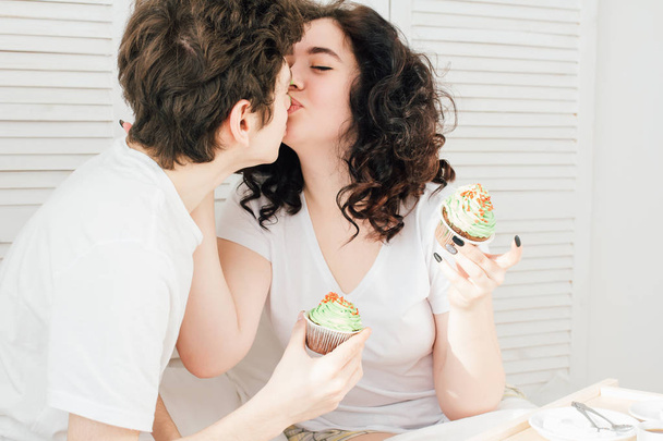 Loving couple dirty their nose with sweet cream - Фото, зображення