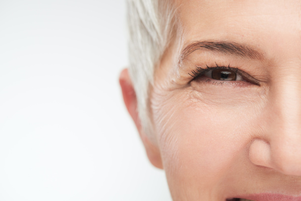 Close up of senir woman eye. - Foto, afbeelding