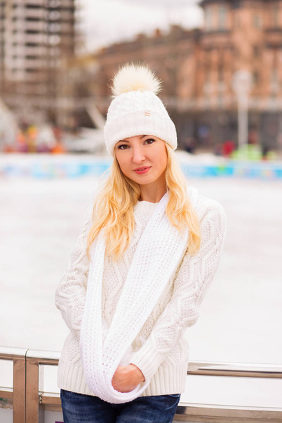 Beautiful blonde girl dreaming at winter time - Photo, Image