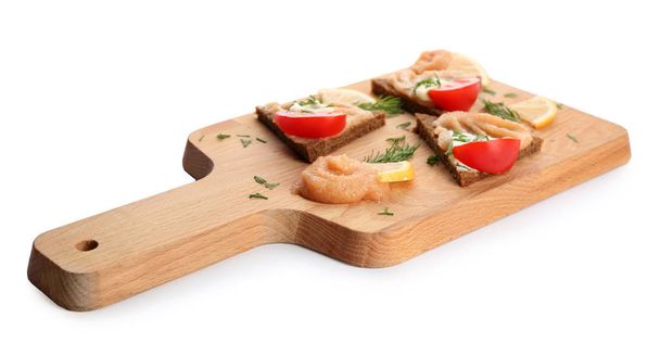 Wooden board with delicious cod caviar appetizers on white background - Zdjęcie, obraz