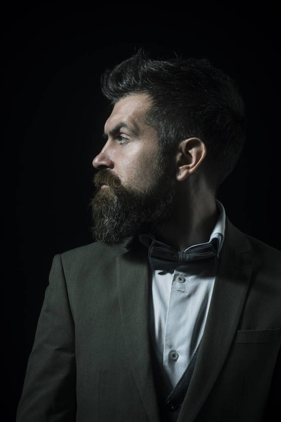 Guy with serious face in luxury suit with bow tie. - Fotoğraf, Görsel
