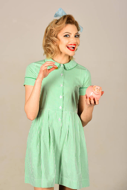 Cute girl hold money box in pinup style - Fotografie, Obrázek