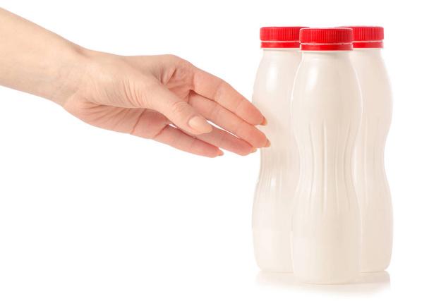 Three plastic white bottles with yoghurt kefir milk in hand - Zdjęcie, obraz
