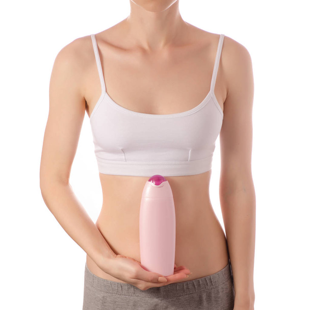 Young beautiful woman in a white T-shirt top bottle of lotion cream for body beauty health - Foto, Imagem