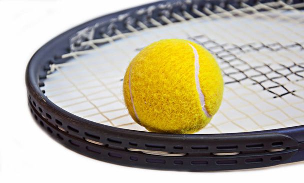 tennis ball on racket on white background - Photo, Image