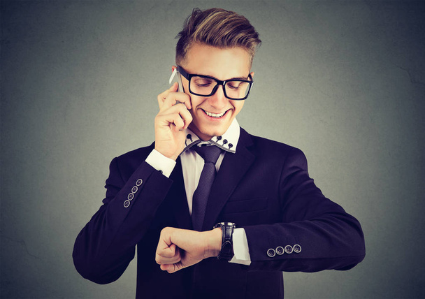Successful young businessman having call - 写真・画像