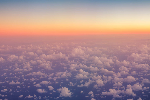 Flying above the clouds. Aerial view from the airplane - Photo, Image