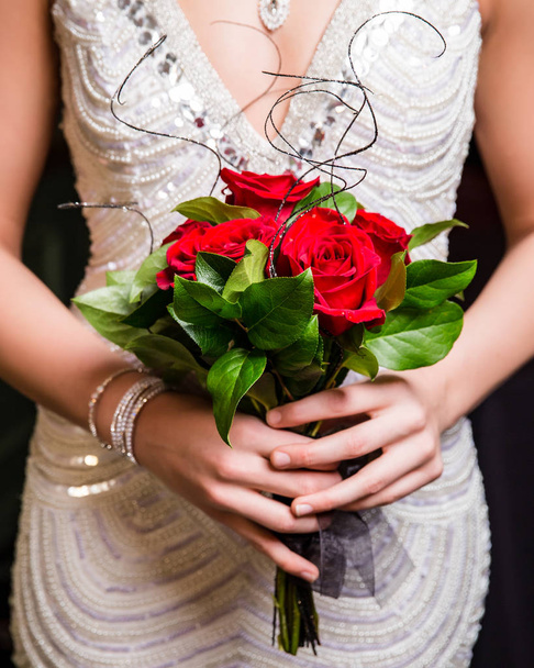 Teen girl holds rose bouquet  - Photo, Image