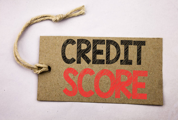 Hand writing text caption inspiration showing Credit Score. Business concept for Financial Rating Record written on price tag paper on the white vintage background. - Photo, Image