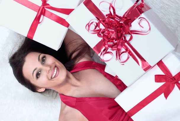 closeup. enthusiastic beautiful woman with her gift. - Photo, Image
