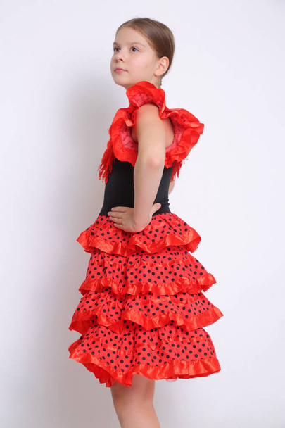Studio image of european teen girl as a flamenco (Spanish) dancer - Фото, изображение