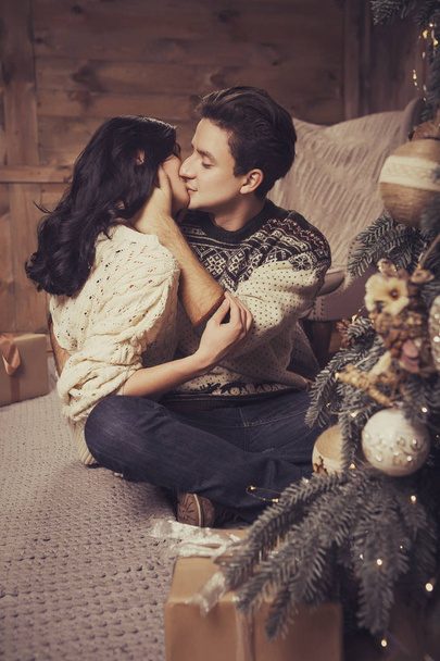 Beautiful brunette caucasian romantic loving couple in cozy warm - Fotó, kép