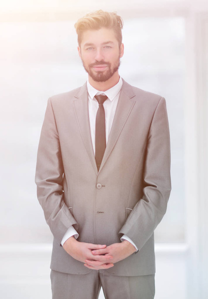 A young man in a gray suit - Photo, image
