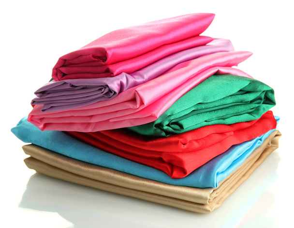 heap of cloth fabrics isolated on white - Фото, изображение