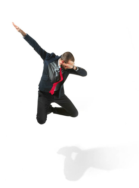 Funny cheerful businessman jumping in air over white background - Φωτογραφία, εικόνα