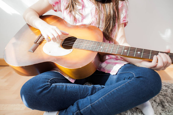 Teenager playing acoustic guitar  - Photo, Image