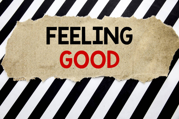 Handwritten text showing Feeling Good. Business concept writing for Happy Positive Attitude Written on note paper, black background with space. - Photo, Image