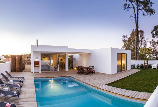 Modern house with garden swimming pool and wooden deck - Photo, Image