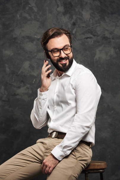 Portrait of a happy young man dressed white shirt - 写真・画像